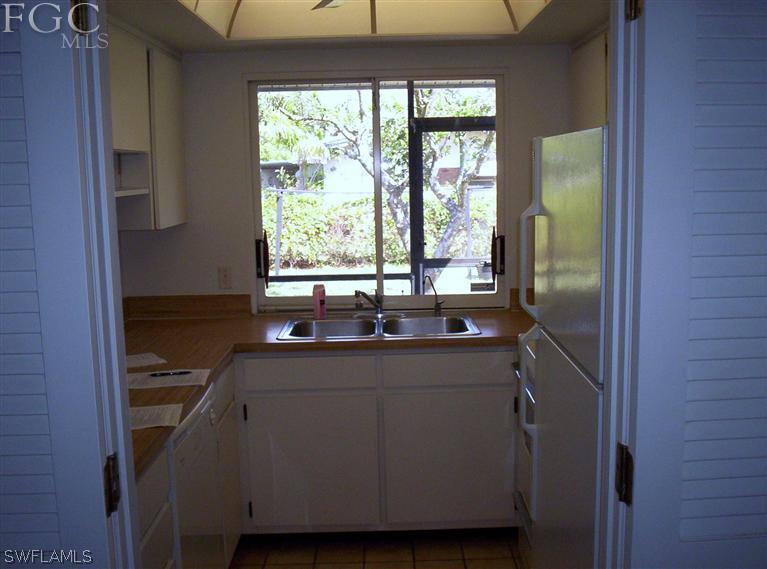 18567 Evergreen Road Fort Myers, FL 33967 - Photo 6 of 12 a kitchen with a sink and large window