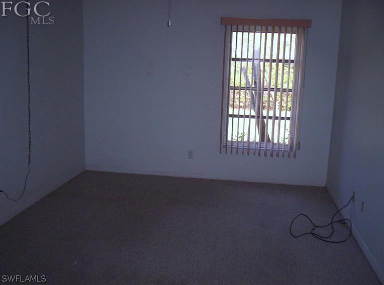 18567 Evergreen Road Fort Myers, FL 33967 - Photo 8 of 12 an empty room with a window