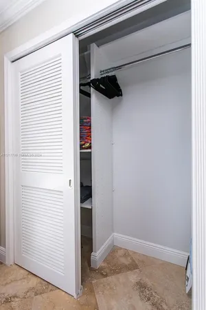 a view of a hallway with closet
