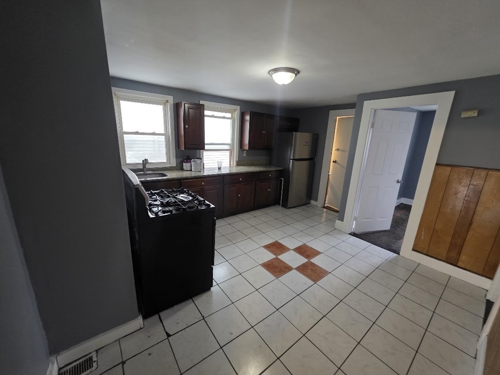 8 Dana, Unit 2 Boston, MA 02136 - Photo 5 of 9 a kitchen with a sink and a refrigerator