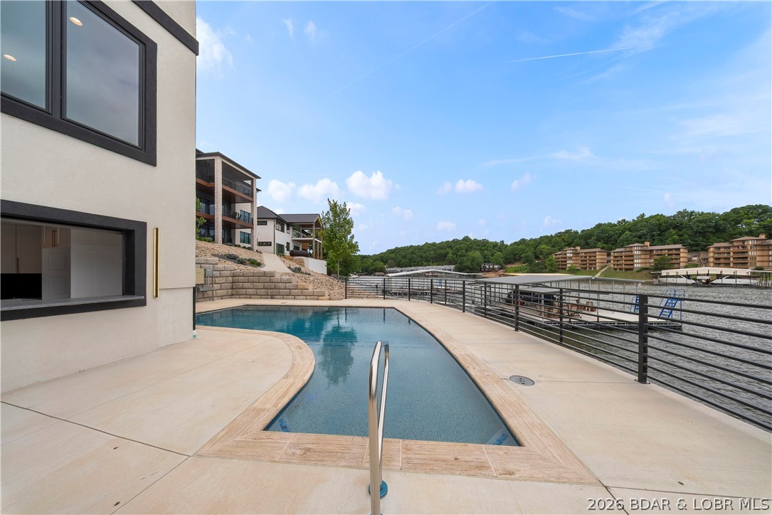 439 Red Bud Road Lake Ozark, MO 65049 - Photo 87 of 98 Resort-style pool perfectly positioned to capture