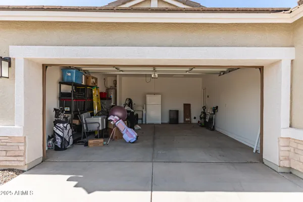 a view of a garage with rack and bicycle