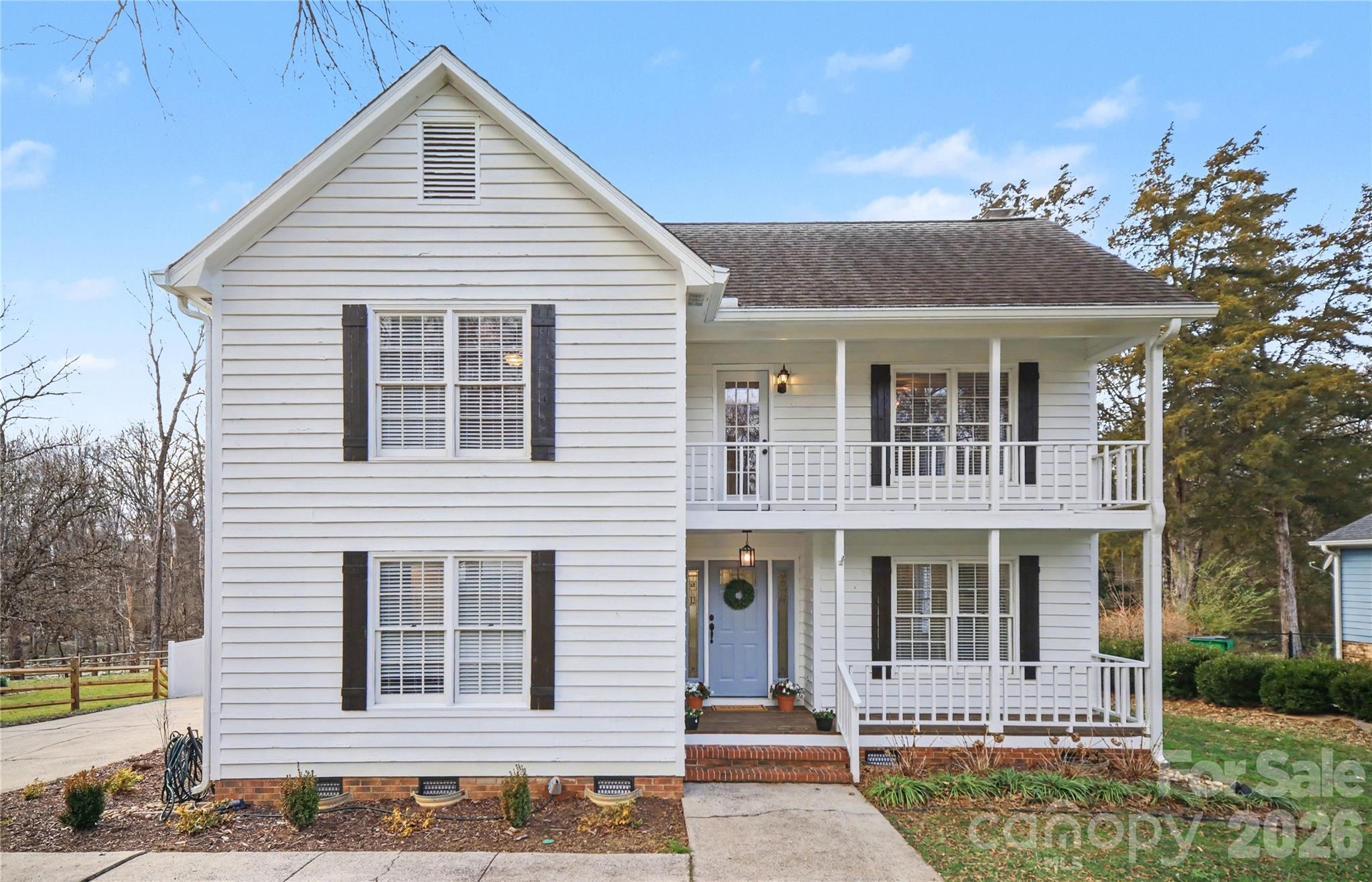 8330 Tifton Road Charlotte, NC 28226 - Photo 1 of 36 a view of a white house with large windows