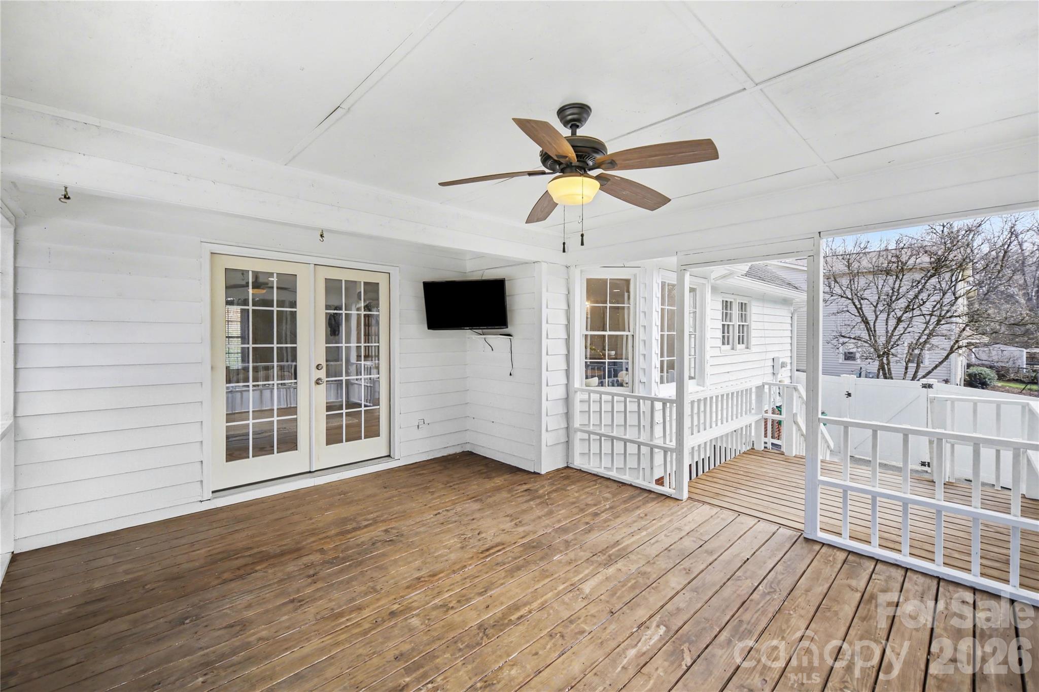 8330 Tifton Road Charlotte, NC 28226 - Photo 17 of 36 a view of an empty room with wooden floor and a window