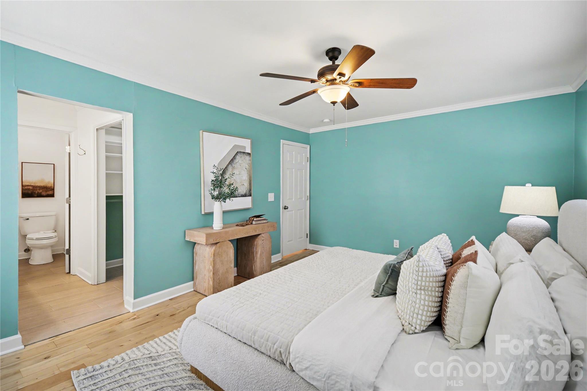 8330 Tifton Road Charlotte, NC 28226 - Photo 20 of 36 a bedroom with a bed and a chandelier
