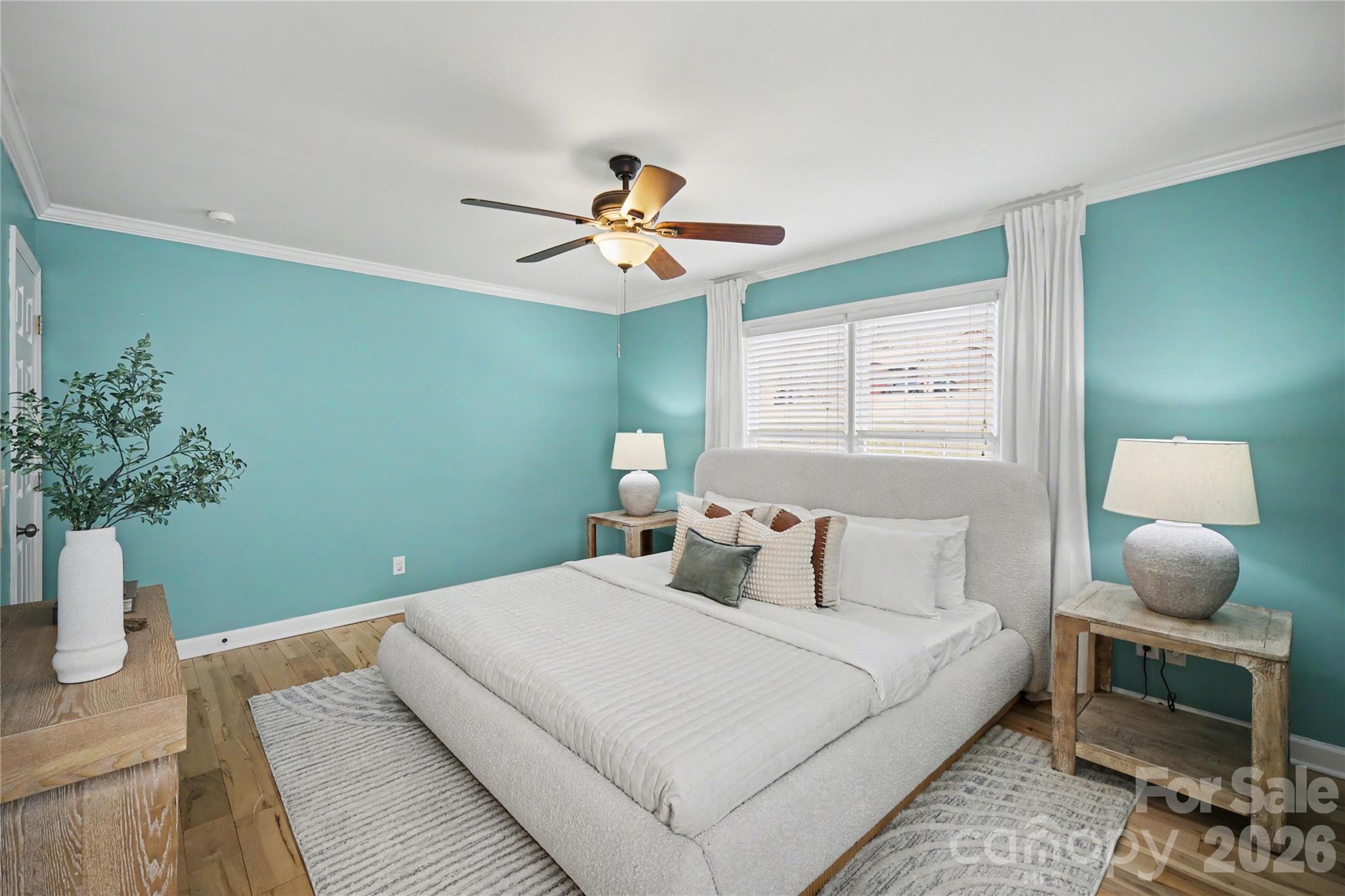 8330 Tifton Road Charlotte, NC 28226 - Photo 21 of 36 a bedroom with a bed and a potted plant