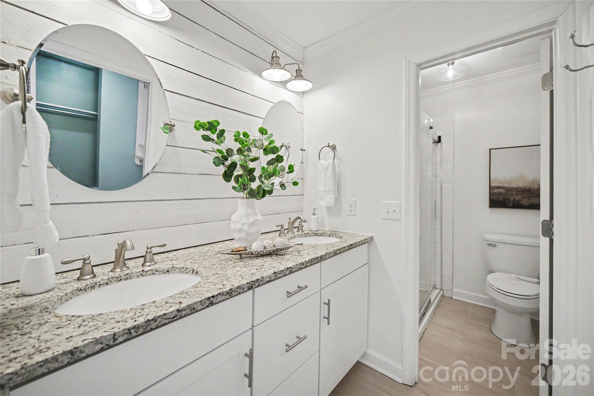 8330 Tifton Road Charlotte, NC 28226 - Photo 22 of 36 a bathroom with a granite countertop sink and a mirror