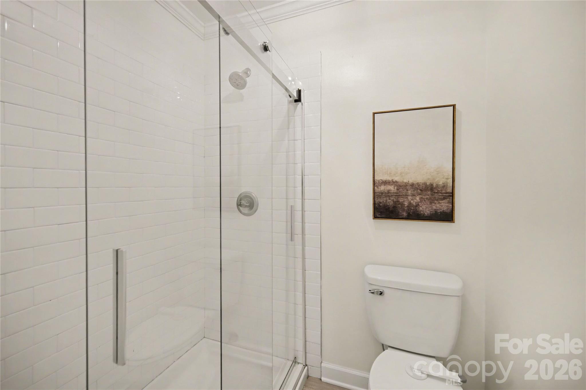 8330 Tifton Road Charlotte, NC 28226 - Photo 23 of 36 a bathroom with a toilet and a shower