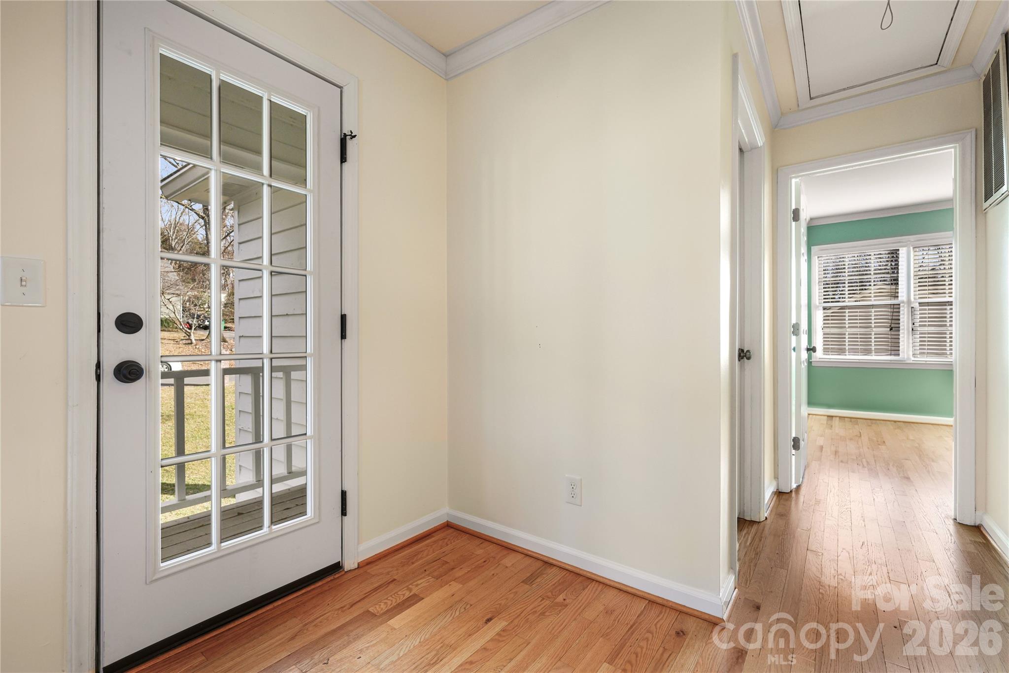 8330 Tifton Road Charlotte, NC 28226 - Photo 30 of 36 a view of an empty room with wooden floor and a window
