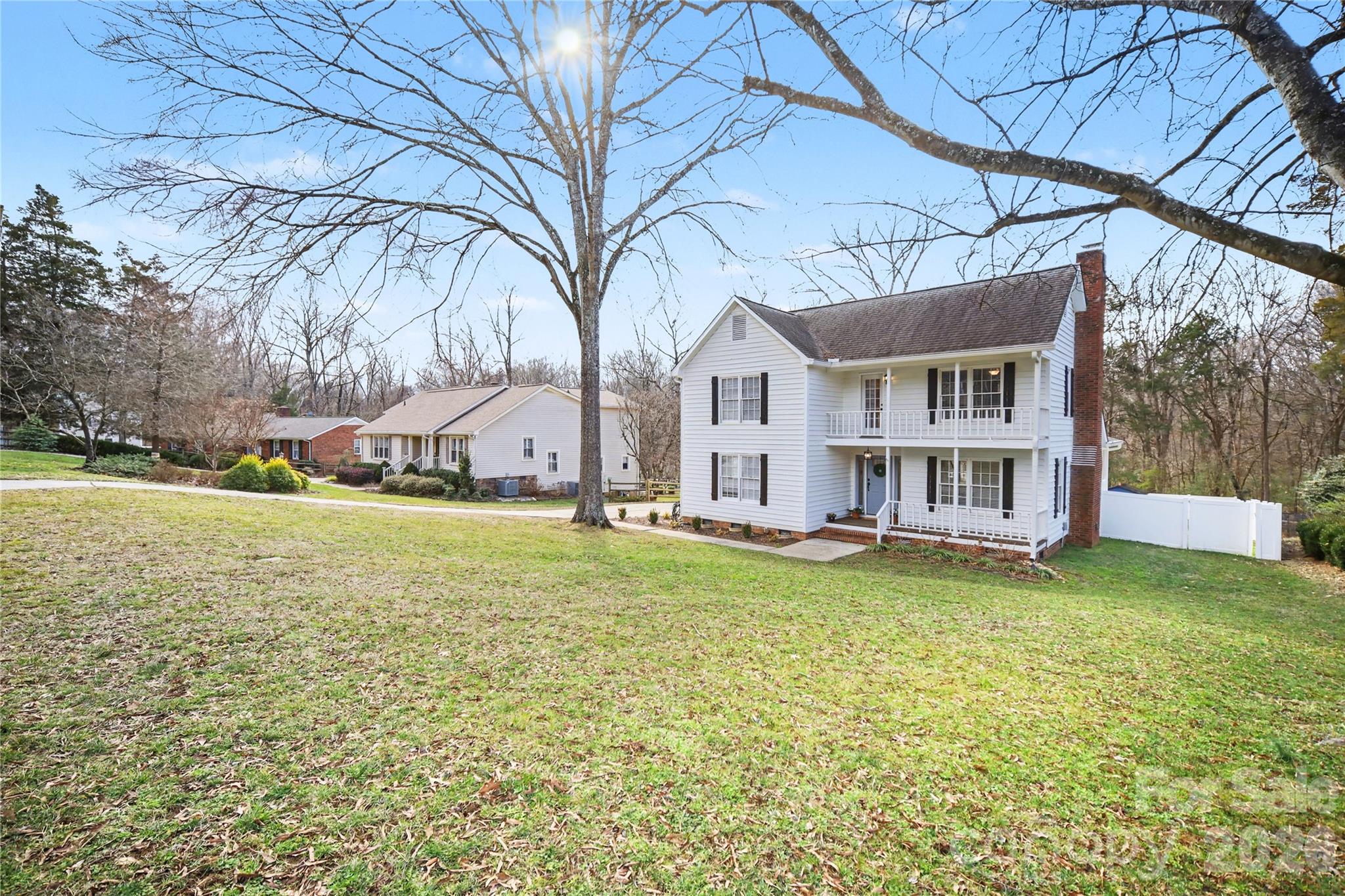 8330 Tifton Road Charlotte, NC 28226 - Photo 3 of 36 a view of a house with a yard and sitting area