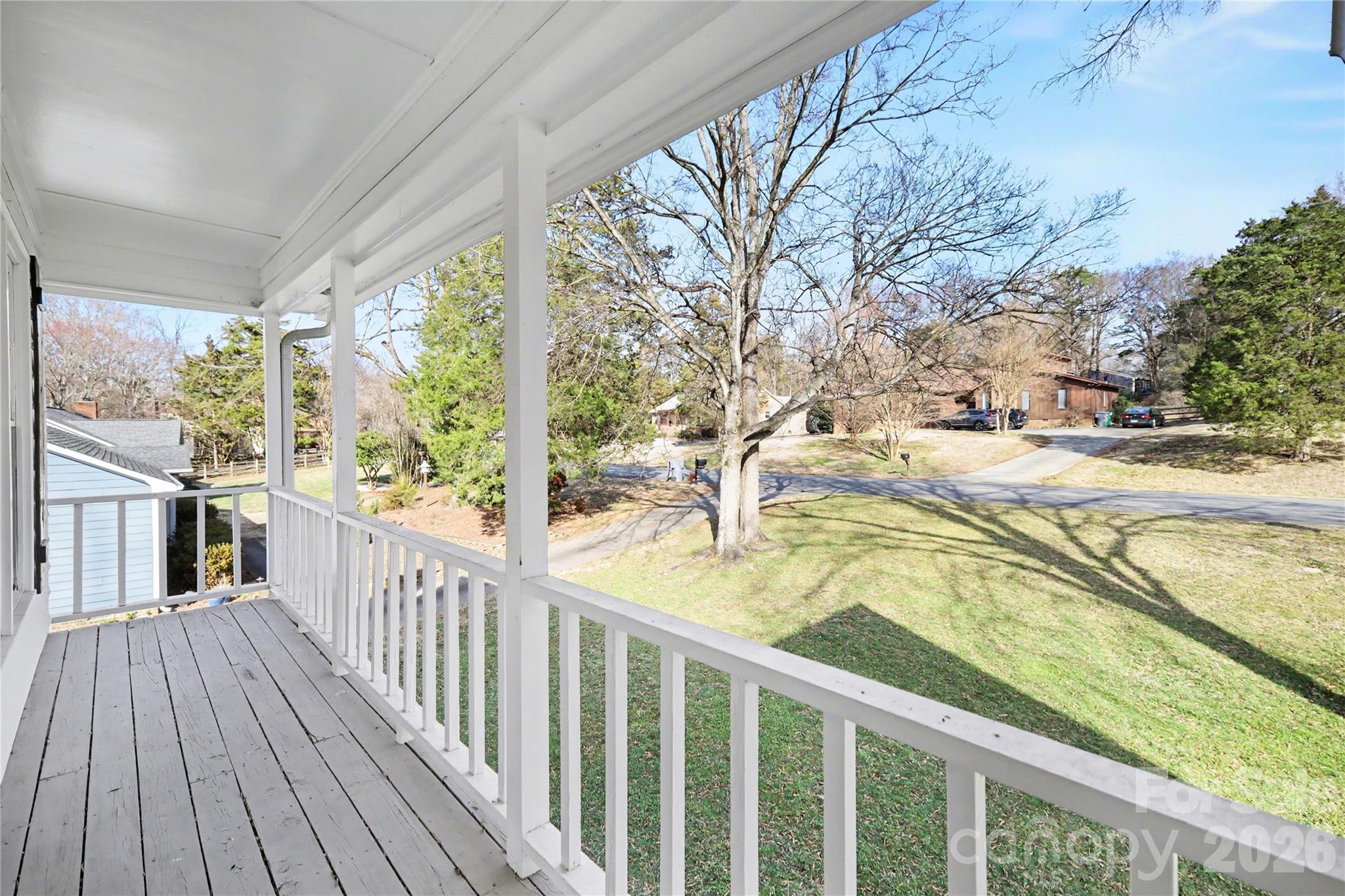 8330 Tifton Road Charlotte, NC 28226 - Photo 5 of 36 a view of a balcony with wooden floor