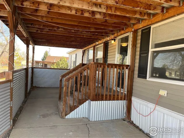 a view of porch with deck and wooden floor