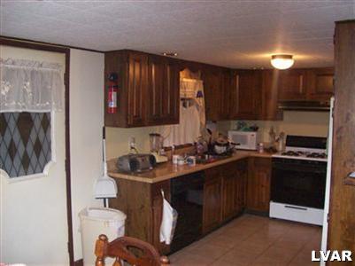6023 Short Road Nazareth, PA 18064 - Photo 7 of 10 a kitchen with a sink cabinets and stainless steel appliances