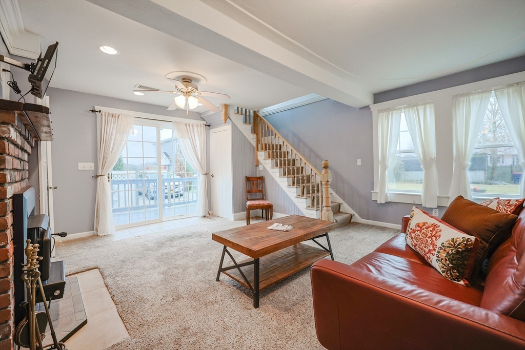 4 Roosevelt Street Wareham, MA 02571 - Photo 11 of 34 a living room with furniture and a large window