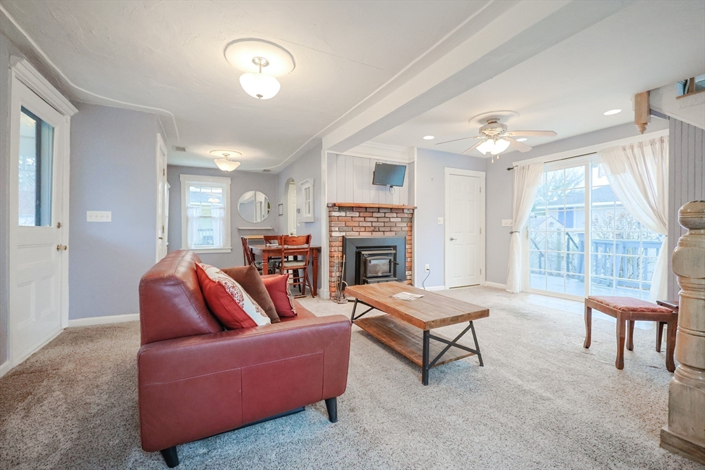 4 Roosevelt Street Wareham, MA 02571 - Photo 8 of 34 a living room with furniture a window and a fireplace