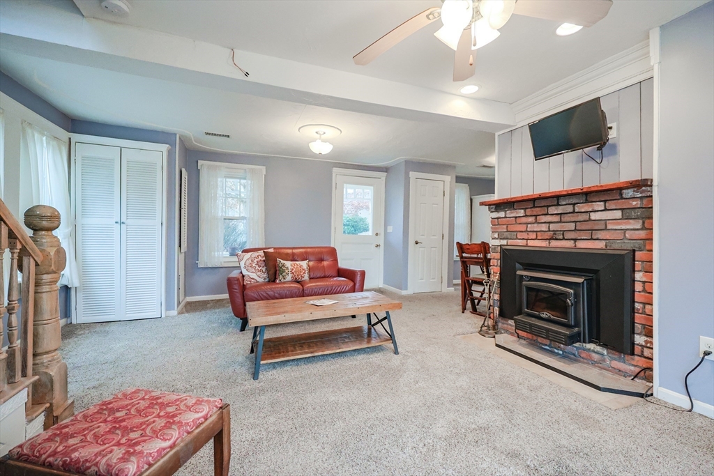 4 Roosevelt Street Wareham, MA 02571 - Photo 9 of 34 a living room with furniture and a fireplace