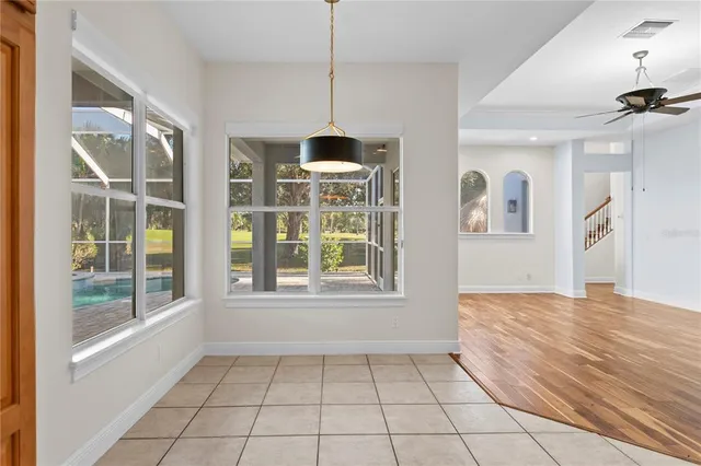 a kitchen with stainless steel appliances granite countertop a sink and a refrigerator