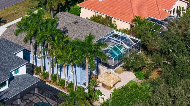 a view of a house with backyard sitting area and livingroom