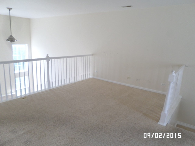 555 Willow Way Lindenhurst, IL 60046 - Photo 9 of 12 a view of an empty room