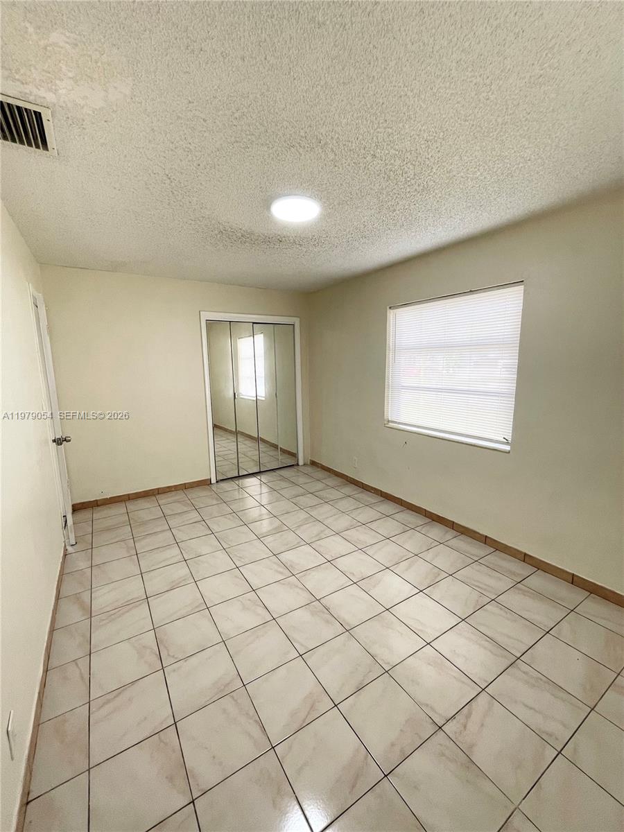 6614 Southwest 20th Street Miramar, FL 33023 - Photo 11 of 28 a view of an empty room and window
