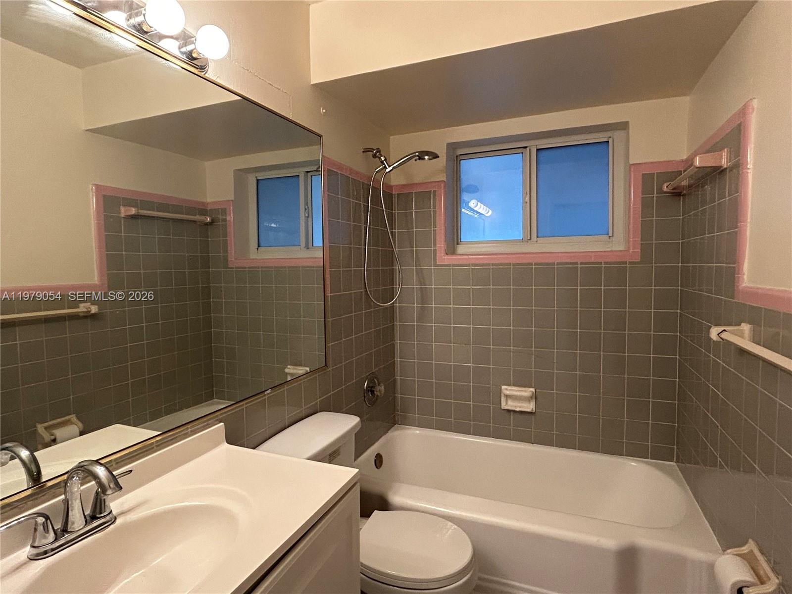 6614 Southwest 20th Street Miramar, FL 33023 - Photo 12 of 28 a bathroom with a sink toilet and shower