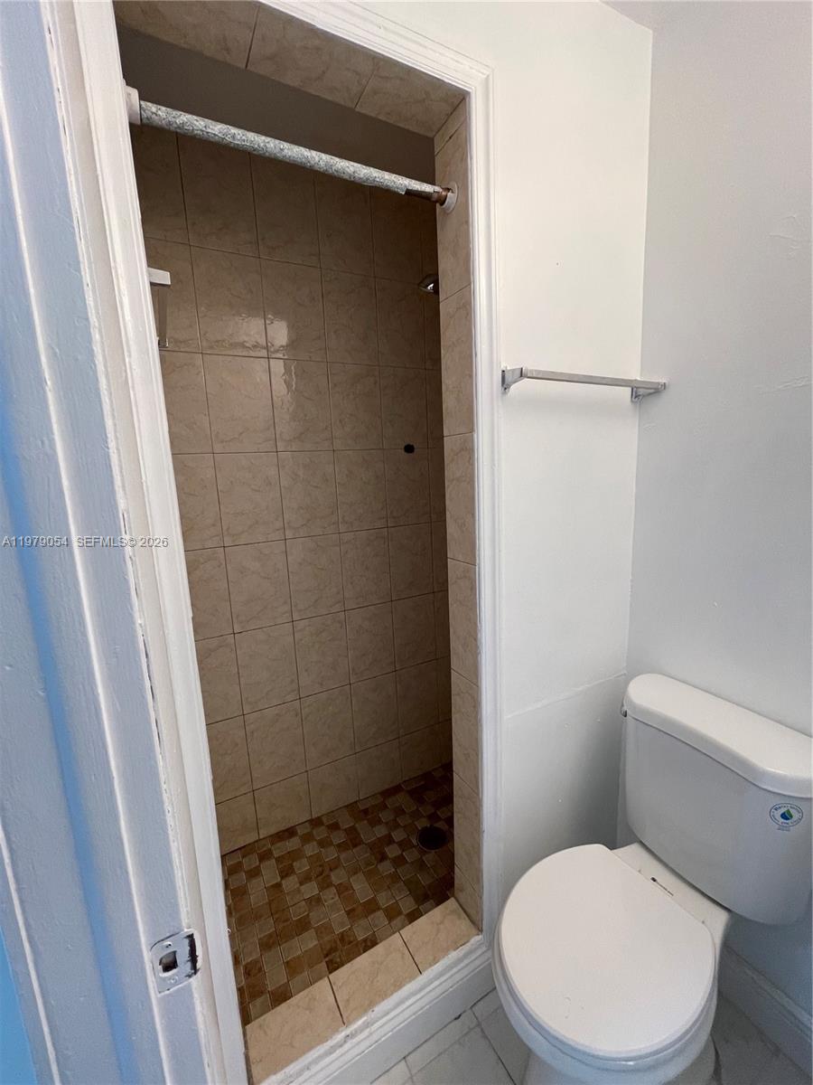 6614 Southwest 20th Street Miramar, FL 33023 - Photo 21 of 28 a bathroom with a shower and a toilet