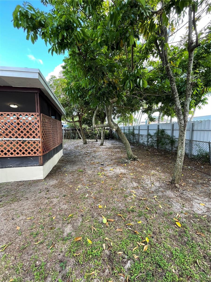 6614 Southwest 20th Street Miramar, FL 33023 - Photo 27 of 28 a backyard of a house with lots of green space