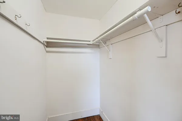 a bedroom with a bed and a lamp