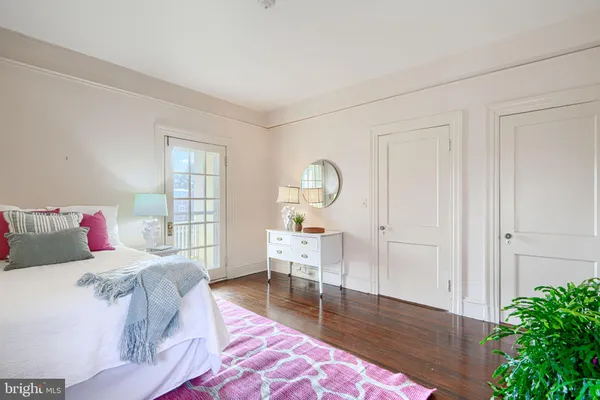 a view of a building with backyard and trees