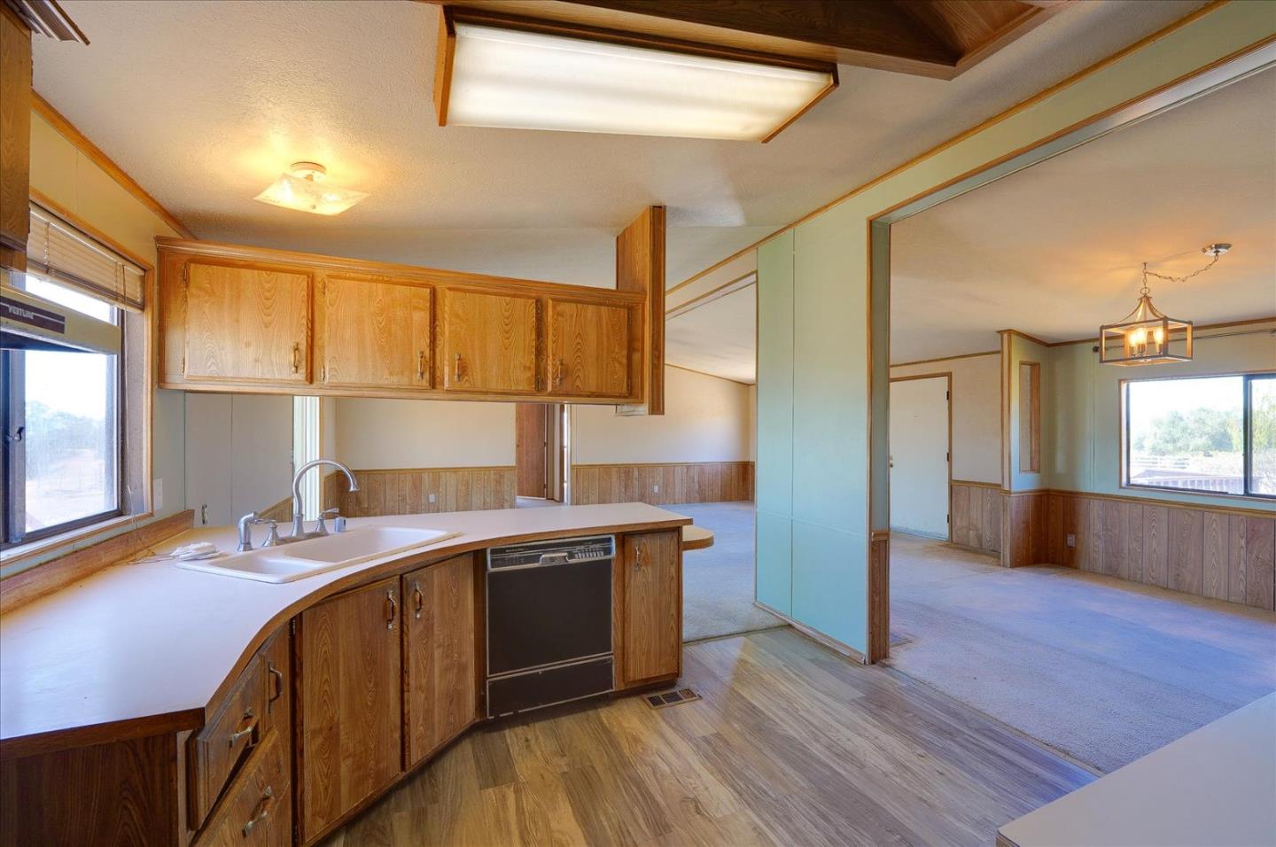 3040 Roop Road Gilroy, CA 95020 - Photo 13 of 63 a kitchen with a sink stove and cabinets