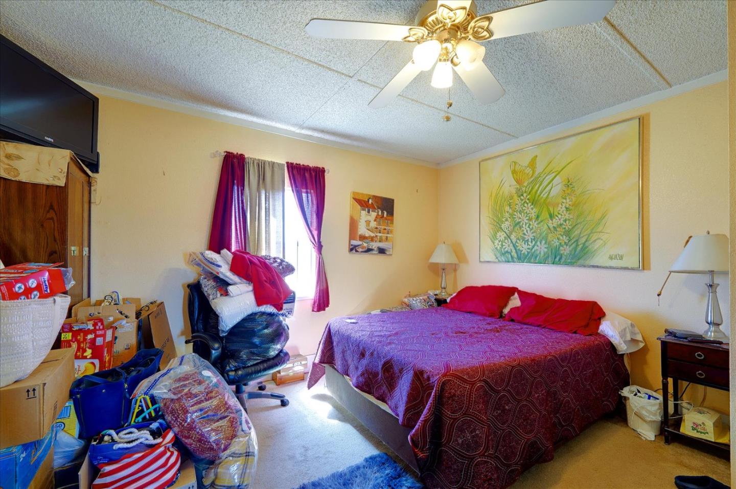 3040 Roop Road Gilroy, CA 95020 - Photo 26 of 63 a bedroom with a bed and a chandelier