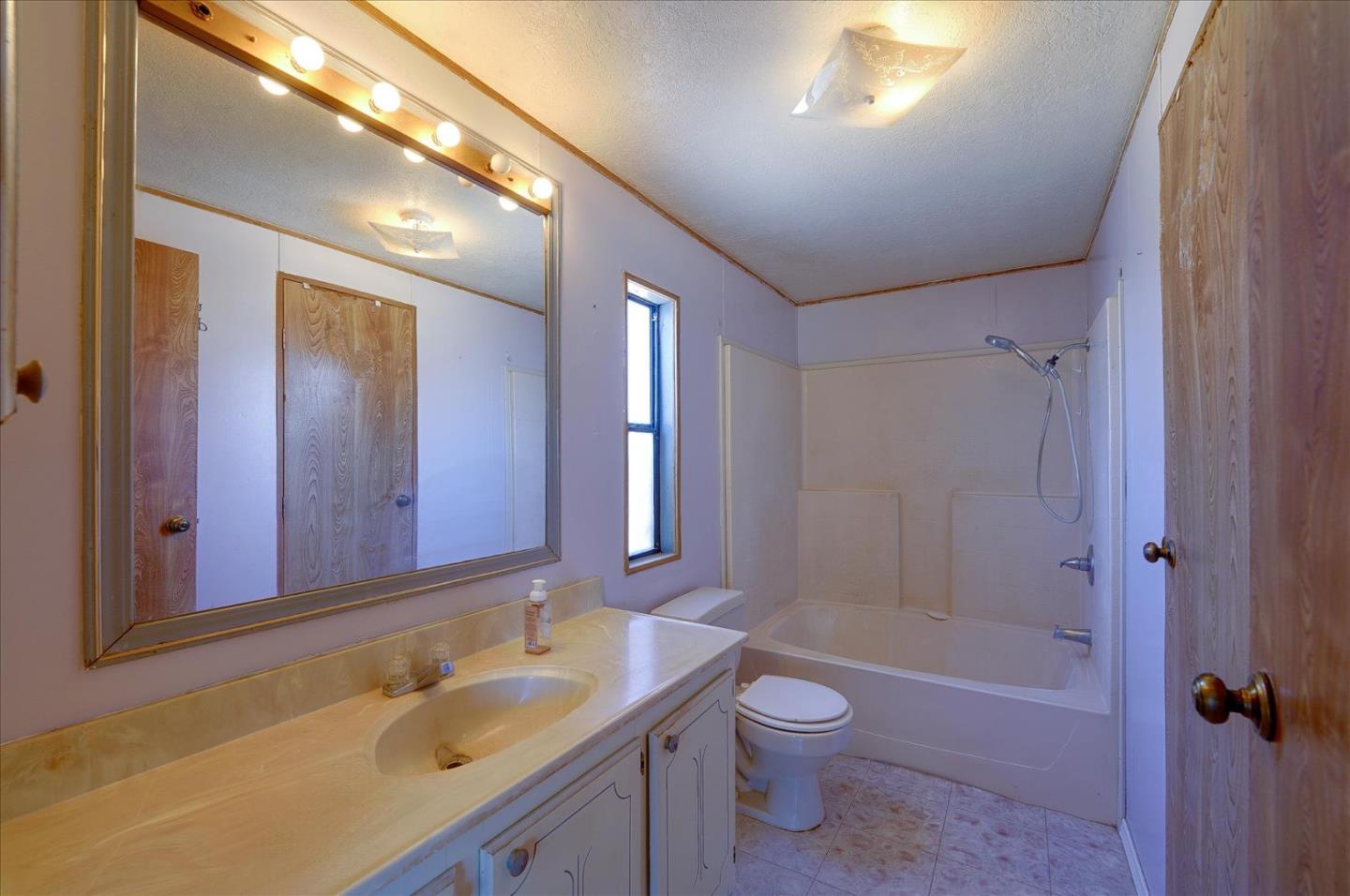 3040 Roop Road Gilroy, CA 95020 - Photo 35 of 63 a bathroom with a sink a toilet and shower