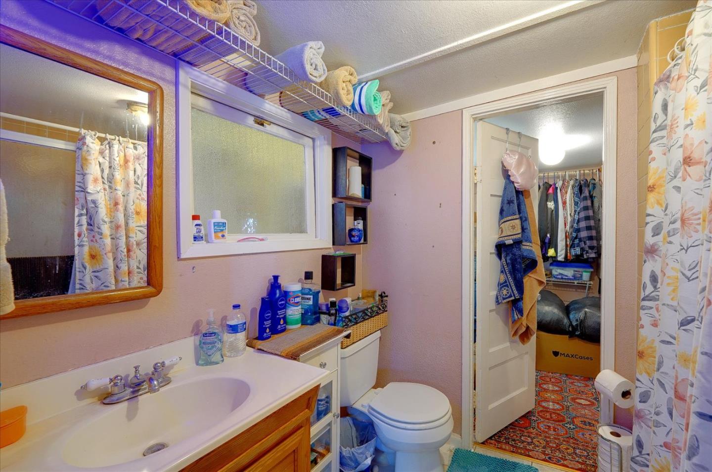 3040 Roop Road Gilroy, CA 95020 - Photo 36 of 63 a bathroom with a sink mirror vanity and toilet