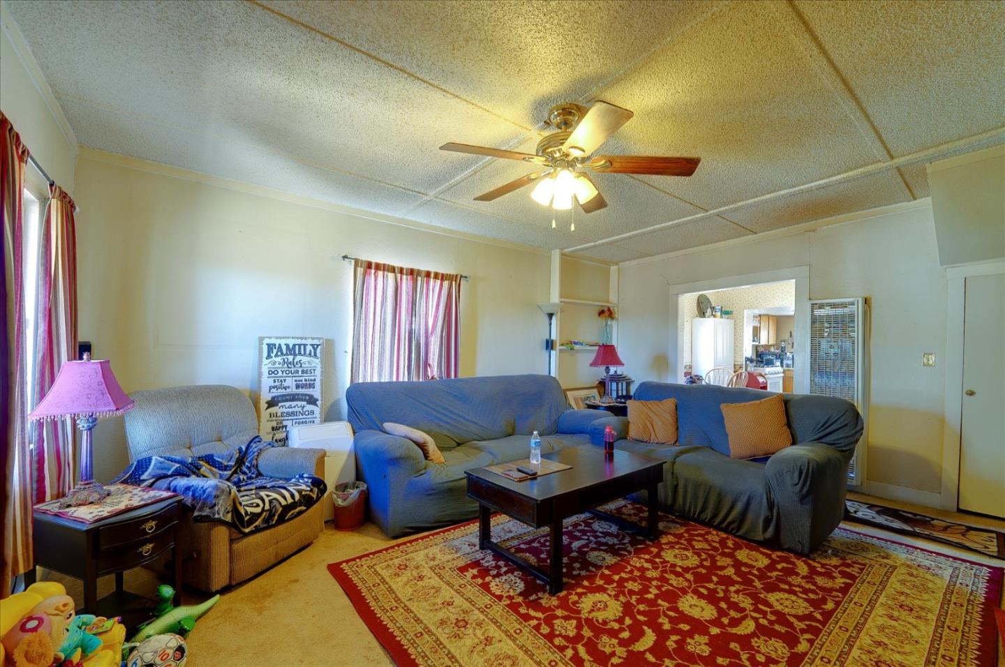 3040 Roop Road Gilroy, CA 95020 - Photo 7 of 63 a living room with furniture and a chandelier