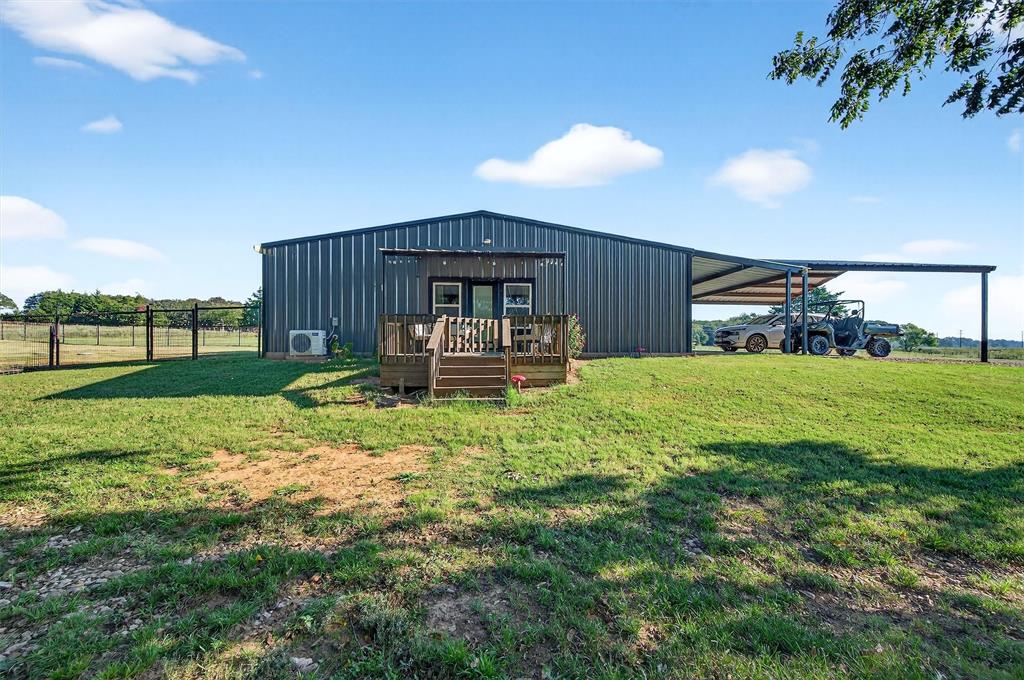 1700 Elmore Road Denison, TX 75021 - Photo 12 of 36 a front view of a house with garden