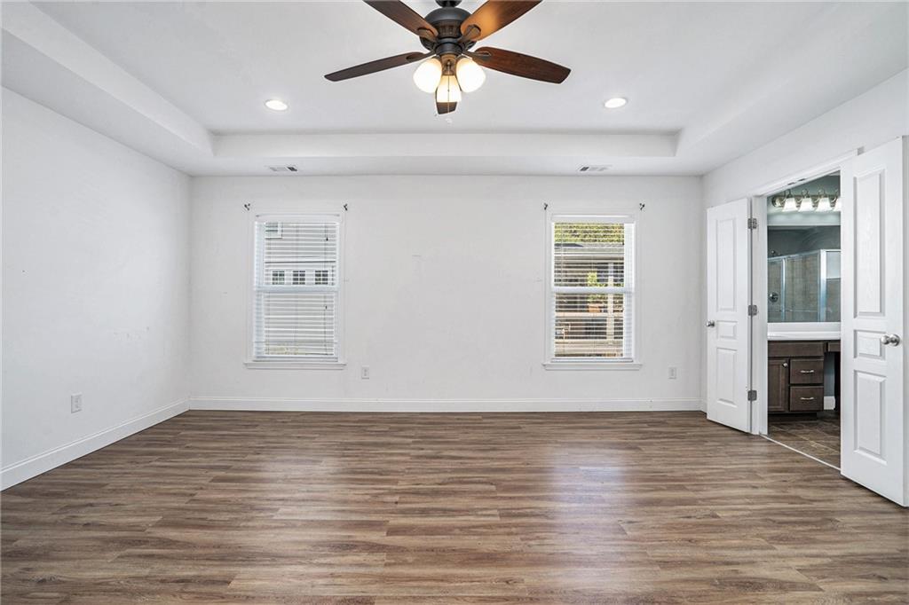 115 Floating Leaf Way Dallas, GA 30132 - Photo 18 of 47 wooden floor in an empty room with a window