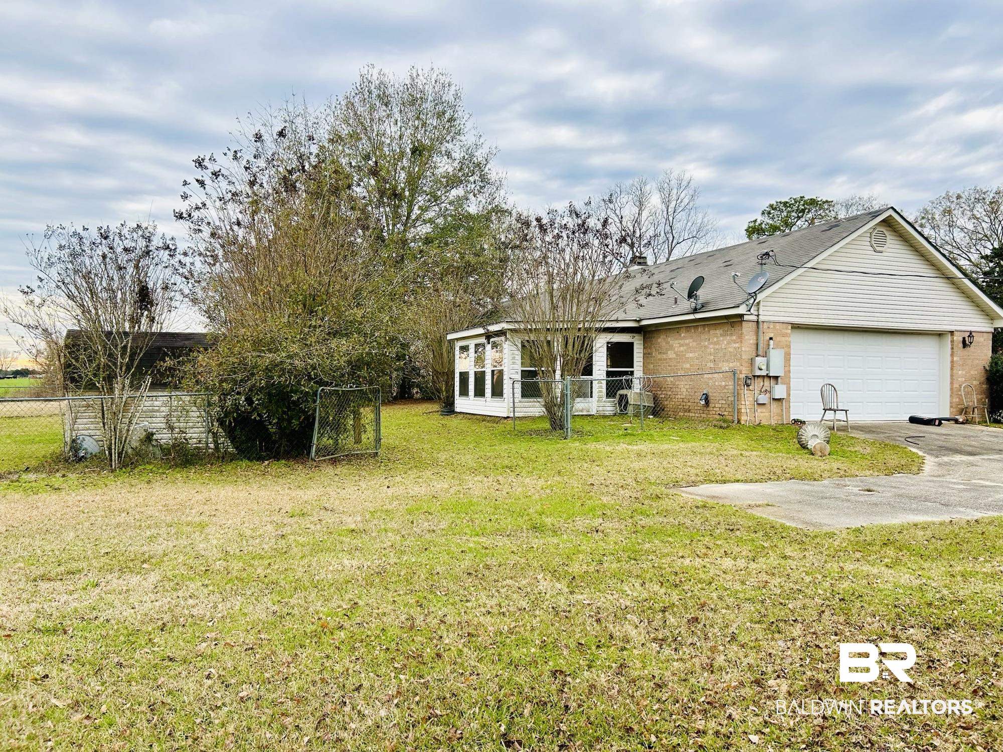 13551 Gaston Loop Road Grand Bay, AL 36541 - Photo 7 of 15 View of yard featuring a garage