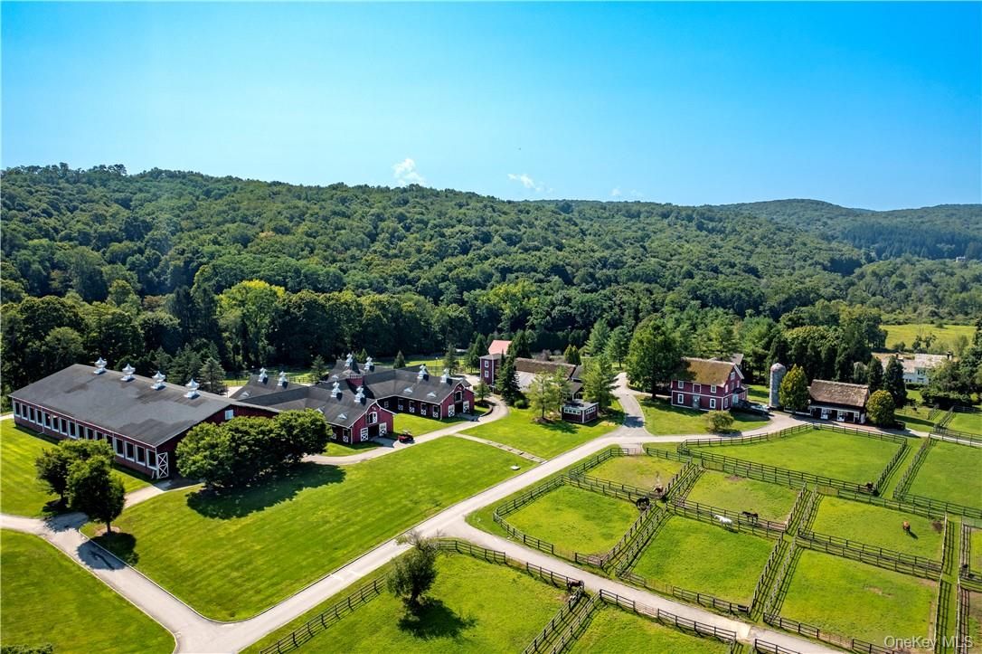 15 Kirby Hill Road Pawling, NY 12564 - Photo 16 of 37 View of main barn and indoor riding ring.