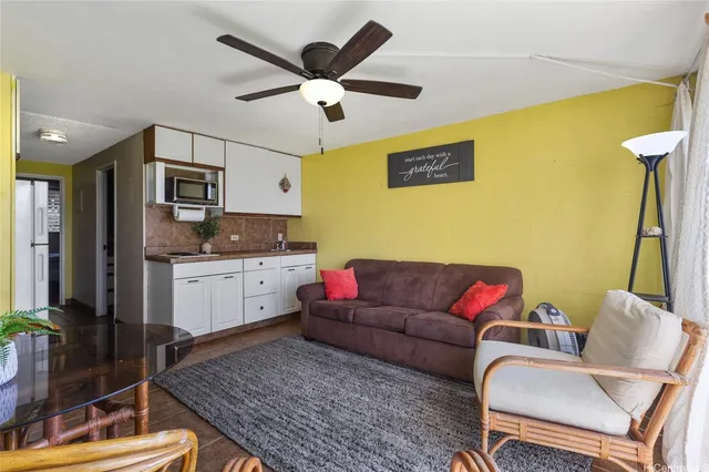 a living room with furniture and a rug