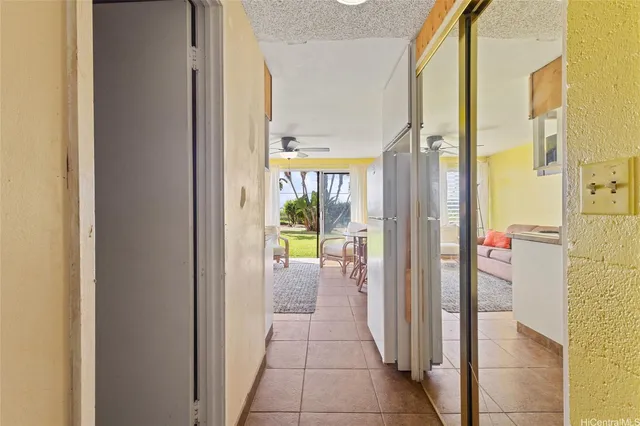 a view of a hallway with a dining area