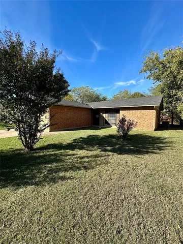 a view of a lake with a house in the background