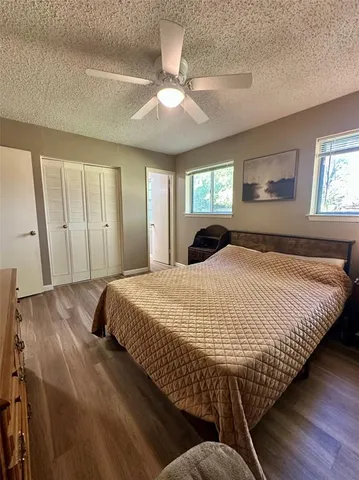 a bedroom with bed and window