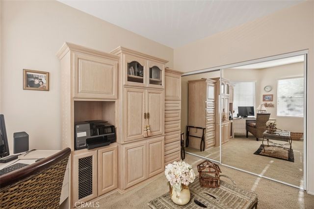a kitchen with a refrigerator and a stove top oven