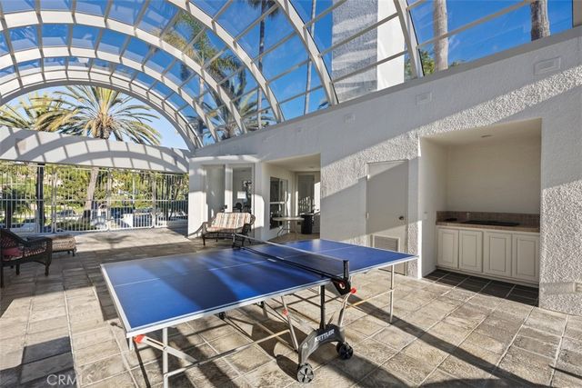 a living room with furniture a fireplace and a table