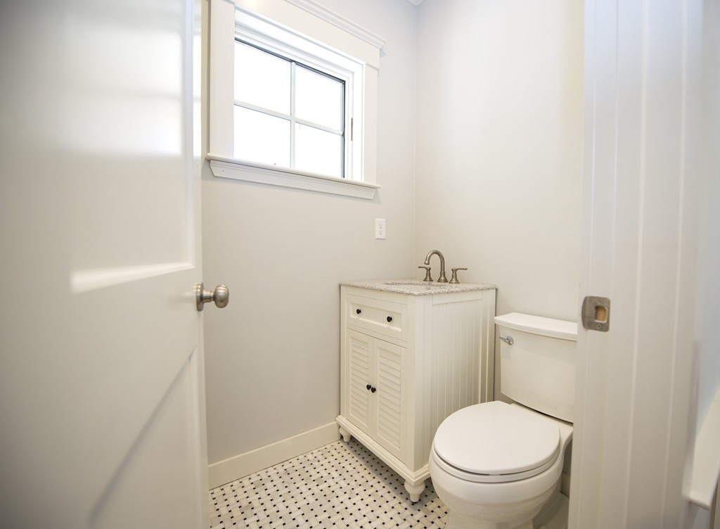 180 First Parish Road Scituate, MA 02066 - Photo 13 of 26 a bathroom with a toilet and a sink