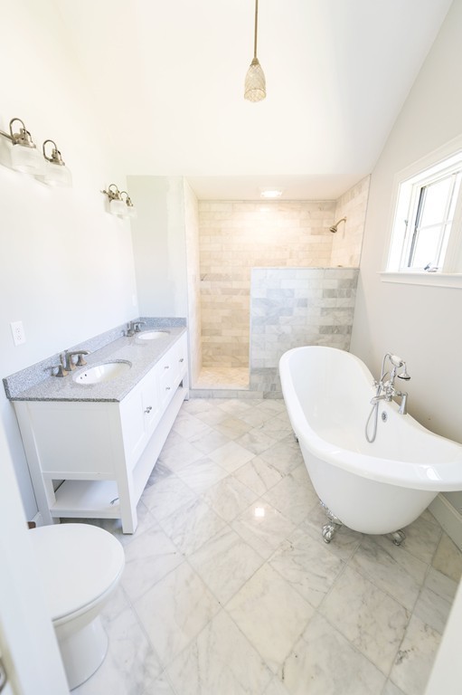 180 First Parish Road Scituate, MA 02066 - Photo 18 of 26 a bathroom with a sink a bathtub and a mirror
