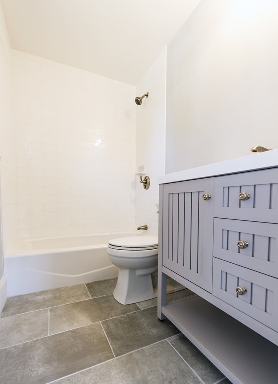 180 First Parish Road Scituate, MA 02066 - Photo 20 of 26 a bathroom with a toilet and a bathtub