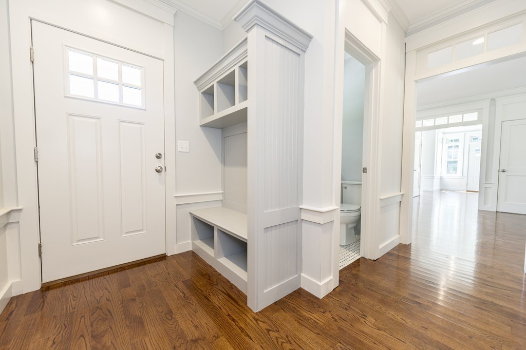180 First Parish Road Scituate, MA 02066 - Photo 6 of 26 a view of empty room with wooden floor and fan
