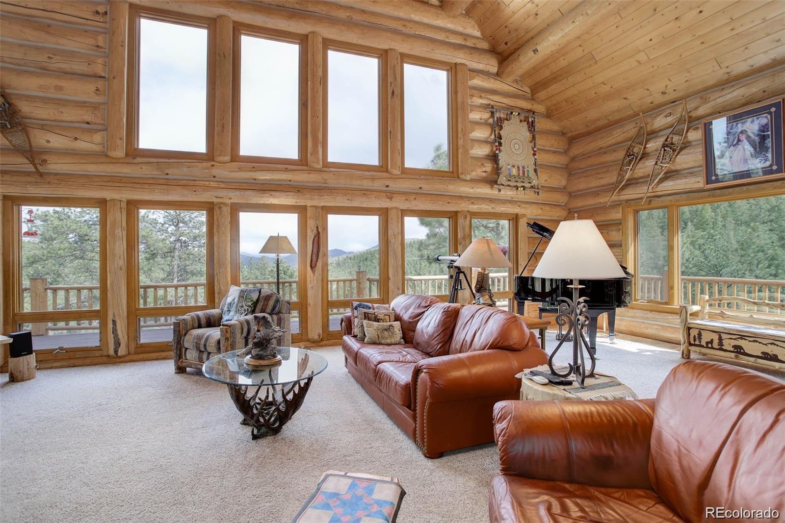 256 Blueberry Drive Bailey, CO 80421 - Photo 12 of 49 a living room with furniture and a large window