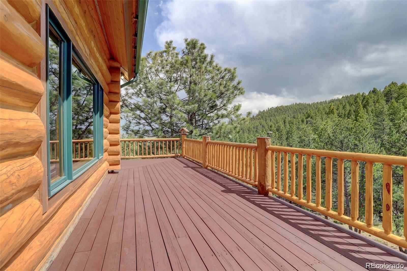 256 Blueberry Drive Bailey, CO 80421 - Photo 42 of 49 a view of balcony with wooden floor